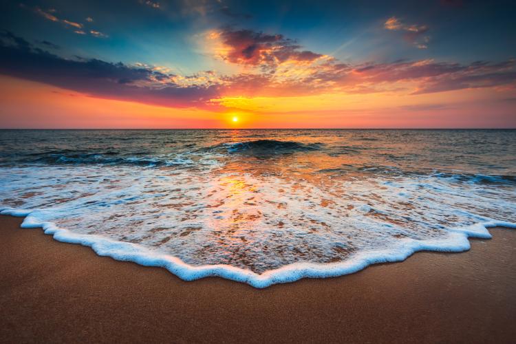 Image of sunset on a beach.